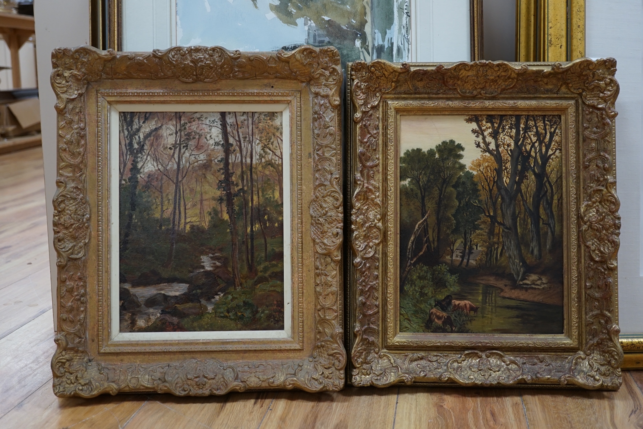 20th century English School, near pair of oils on canvas, Wooded landscapes with streams, 29 x 22cm. Condition - fair to good